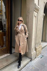 a lady wears a worsted woolen double-breasted trench coat